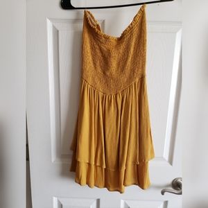 Smocked dress with tie details on back